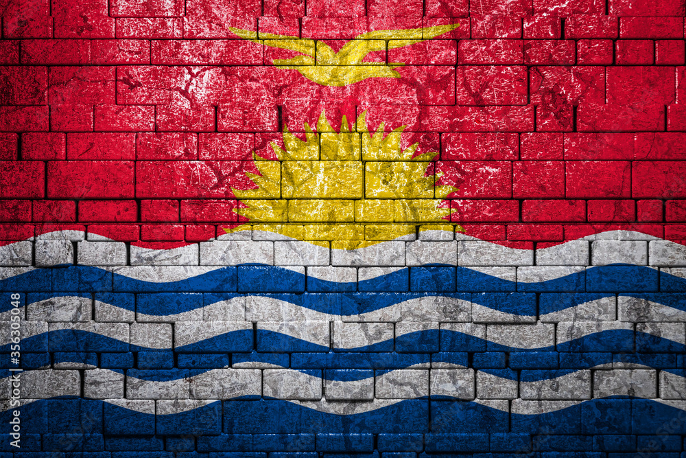 National flag of Kiribati on brick wall background.The concept of national pride and symbol of the country. Flag banner on stone texture background. National flag of Kiribati on brick wall background.The concept of national pride and symbol of the country. Flag banner on stone texture background.