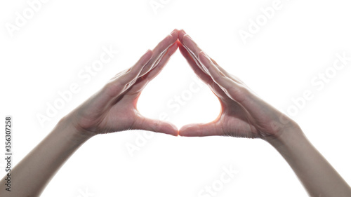 Woman hand showing triangle sign on white isolated background. photo