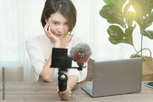 Female blogger recording broadcast video at home, Fashion, makeup, technology concept
