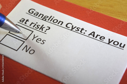 Canvas Print One person is answering question about ganglion cyst.