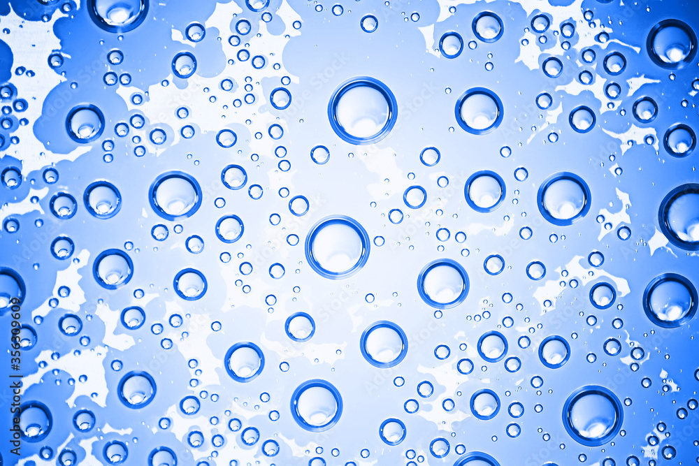 fresh drops background blue glass / wet rainy background, water drops transparent glass blue