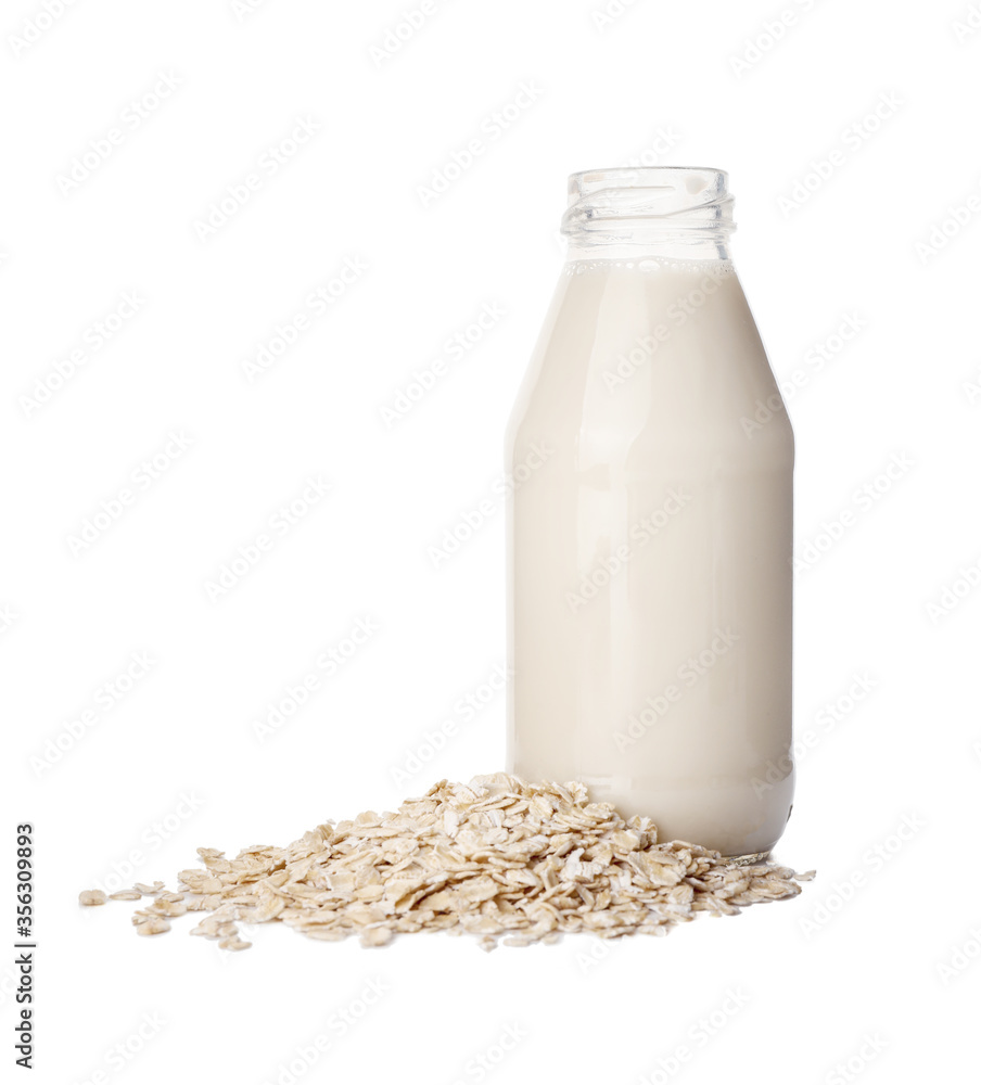 Bottle of tasty oat milk on white background