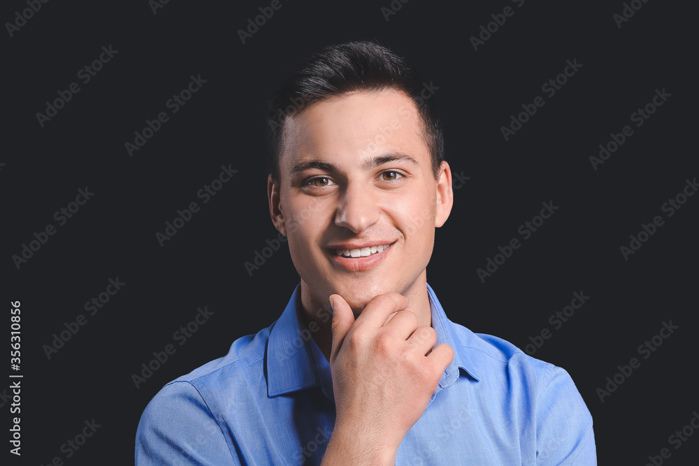 Portrait of handsome businessman on dark background Portrait of handsome businessman on dark background