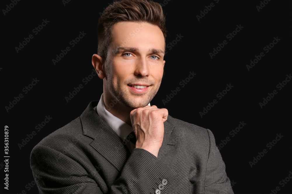 Portrait of handsome businessman on dark background Portrait of handsome businessman on dark background