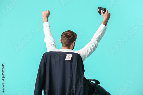 Young businessman with game...