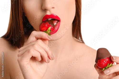 Sexy young woman with straw...