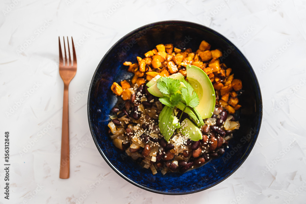 plant-based food, vegan mexican bowl with spicy beans pumpkin cubes and avocado topped with cfresh cilantro plant-based food, vegan mexican bowl with spicy beans pumpkin cubes and avocado topped with cfresh cilantro