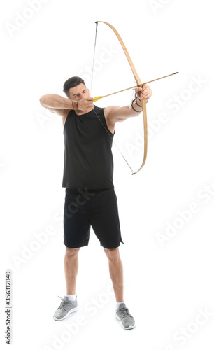 Handsome man with crossbow on white background