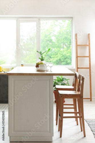 Interior of modern kitchen with stylish table