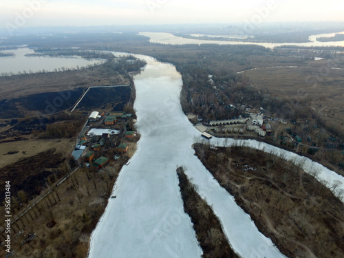 Aerial view of the countryside (drone image).Near river Desna.Winter time.Sunset. Near Kiev,Ukraine