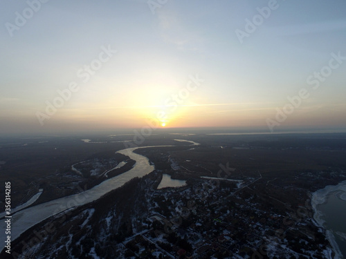 Aerial view of the countryside (drone image).Near river Desna.Winter time.Sunset. Near Kiev,Ukraine © Sergey Kamshylin