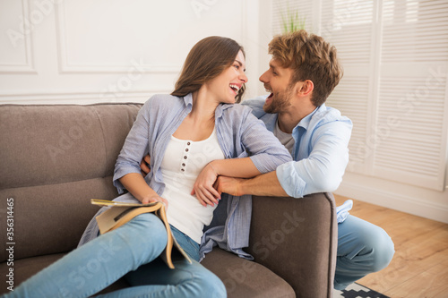 Young happy couple spending day at home and feeling amazing