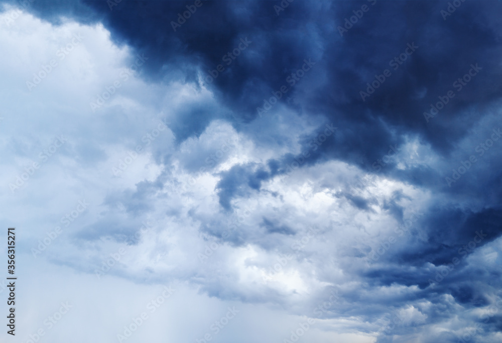 Stormy cloudy sky panorama, dark blue thunderclouds, white fluffy cumulus clouds closeup, rainy thunderstorm landscape, overcast bad weather, cloudiness skies, cloudscape, atmosphere, heaven view, air Stormy cloudy sky panorama, dark blue thunderclouds, white fluffy cumulus clouds closeup, rainy thunderstorm landscape, overcast bad weather, cloudiness skies, cloudscape, atmosphere, heaven view, air