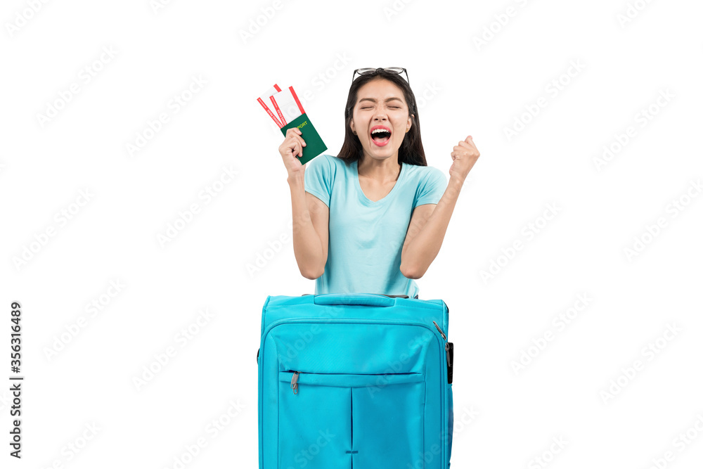Asian woman with ticket and passport leaning on suitcase Asian woman with ticket and passport leaning on suitcase