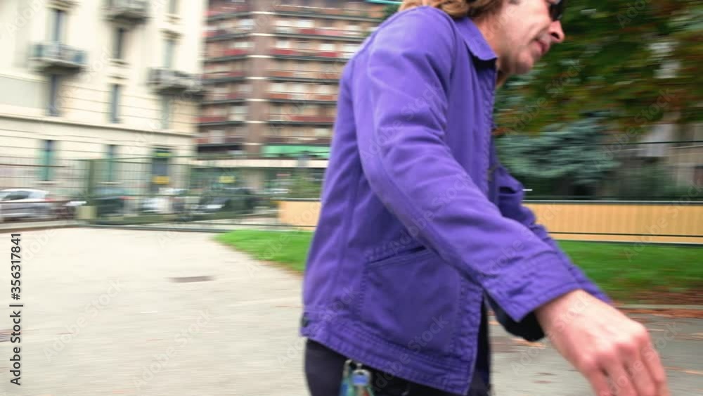 WS MS TS Couple skateboarding in park / Milan, Italy