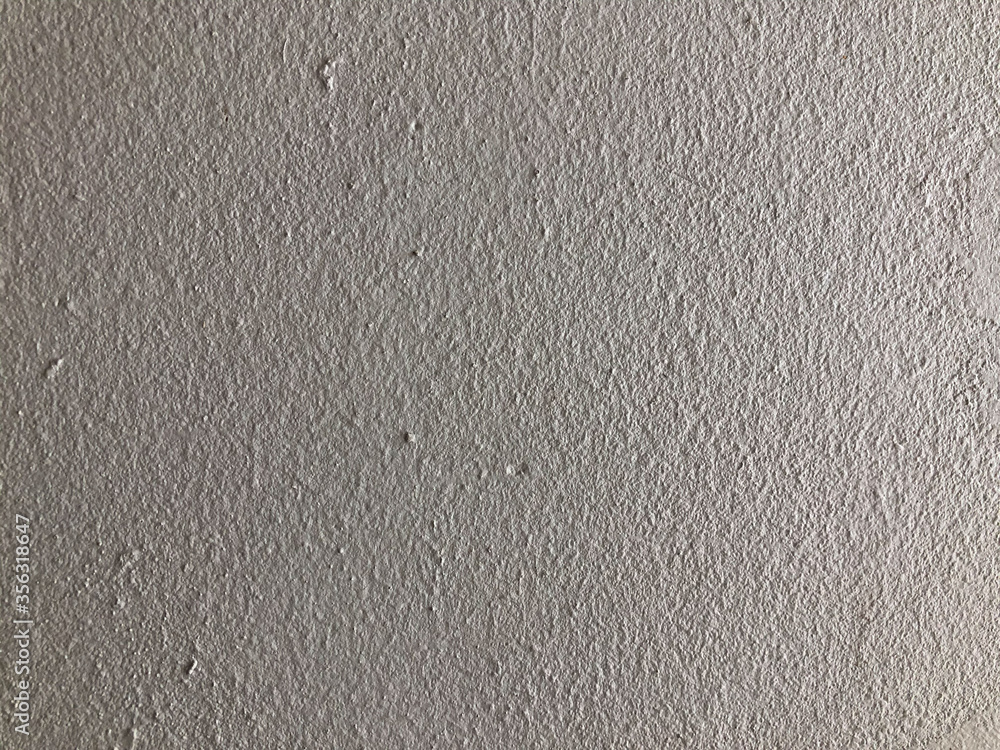 The gray cement background wall has a pattern made of cement plaster. The gray cement background wall has a pattern made of cement plaster.