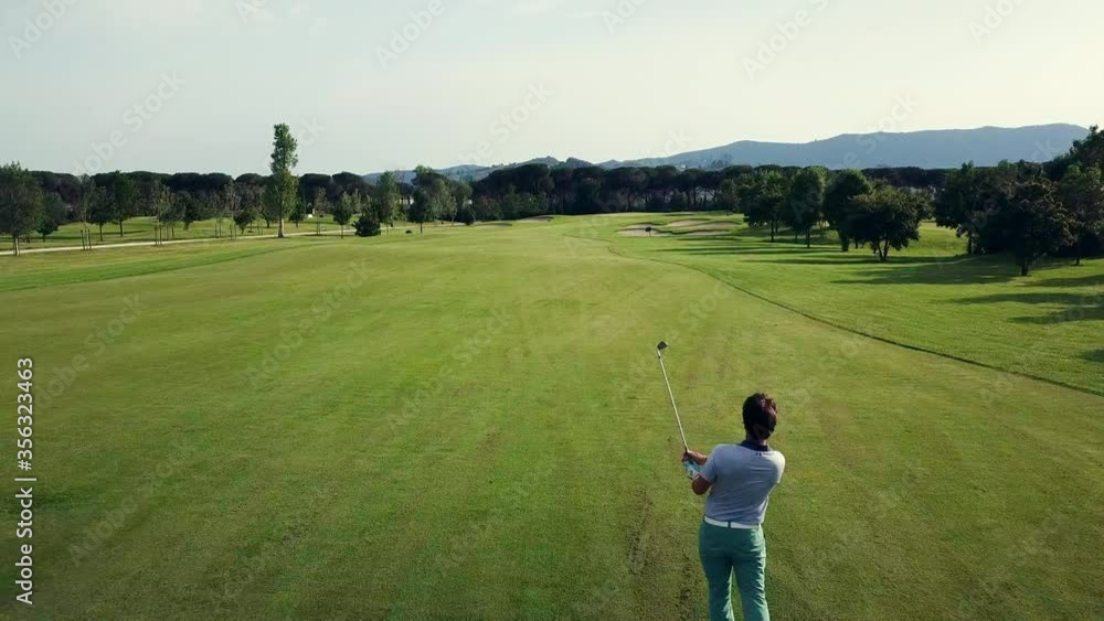 AERIAL WS Men playing golf on sunny day / Prato, Florence, Italy AERIAL WS Men playing golf on sunny day / Prato, Florence, Italy