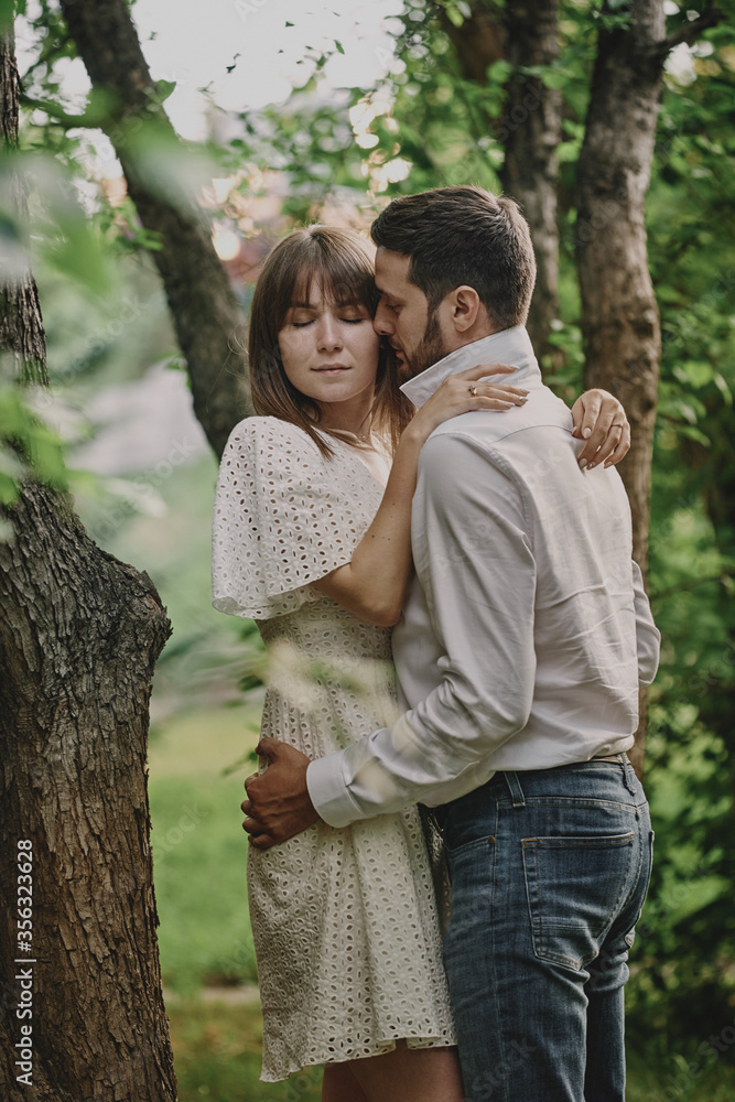 © ssergiocom - A guy and a girl are walking in the park. Romantic date evening walk. The relationship between people is love and tenderness. © ssergiocom - A guy and a girl are walking in the park. Romantic date evening walk. The relationship between people is love and tenderness.