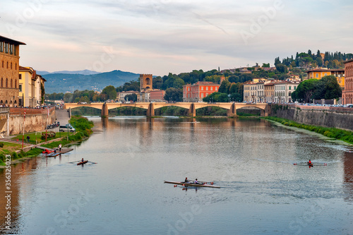 Scenic view of the Arno river, the main waterway of Tuscany region running through the medieval city of Florence in Italy