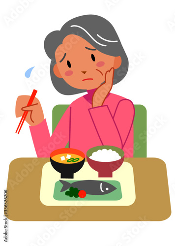 食欲不振のシニア女性

