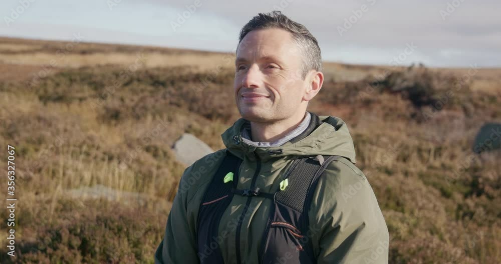 MS Portrait of smiling man in landscape / Yorkshire Moors, Yorkshire, UK MS Portrait of smiling man in landscape / Yorkshire Moors, Yorkshire, UK