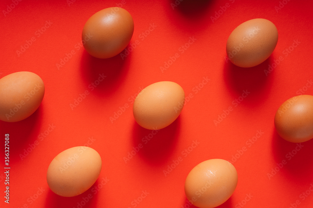 Group of brown chicken egg isolated on red background. Background. Group of brown chicken egg isolated on red background. Background.