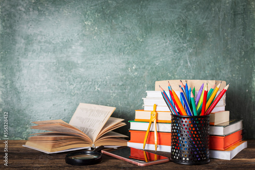 School books on desk, education concept. books on the table in the audience, close up