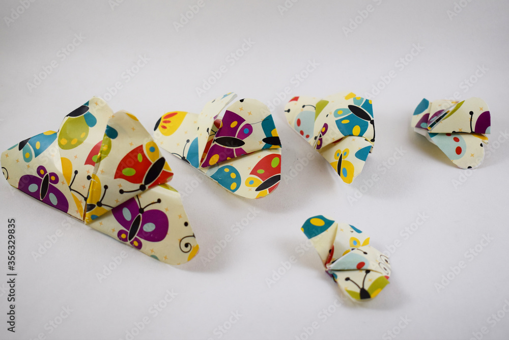 Paper Handmade Colorful butterflies on a white background – Delhi, India .