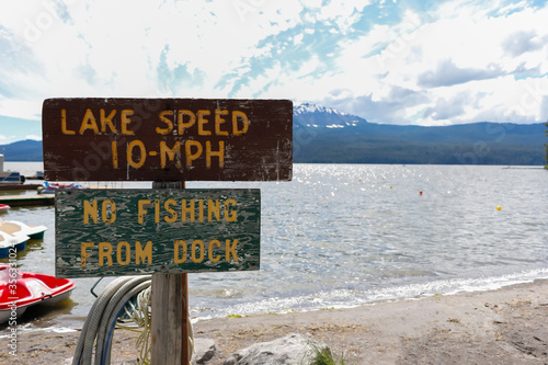 Speed limit sign in pier on the lake for tourist and visitor to safety in Beautiful Nature at Diamond Lake, Oregon