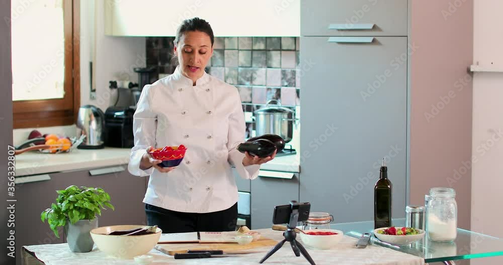 MS Female chef recording program in kitchen / Florence, Tuscany, Italy MS Female chef recording program in kitchen / Florence, Tuscany, Italy