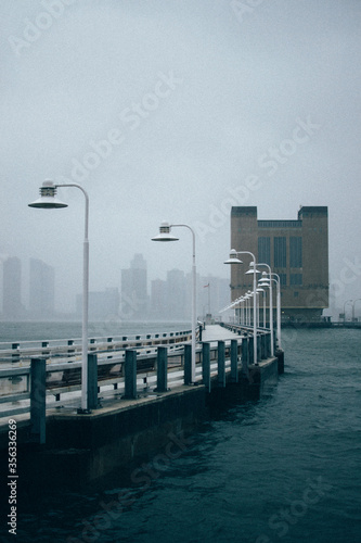 Foggy pier with lamps photo