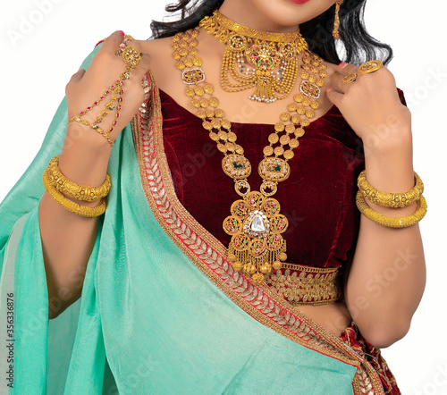 Fotografie Beautiful girl with gold jewelry for woman ,necklace ,earrings and bracelet
