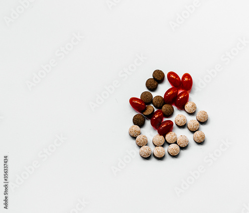 pills of different colors and composition