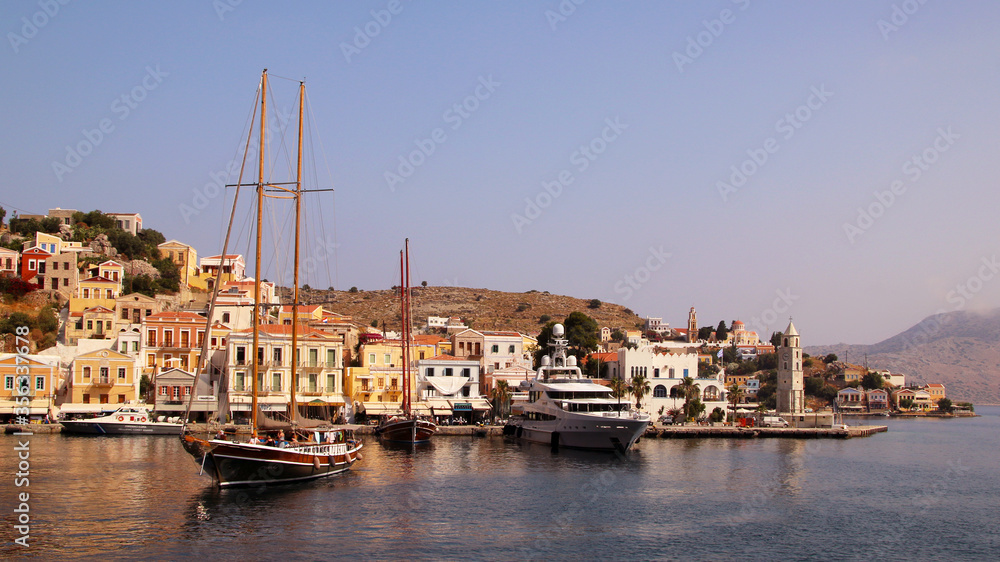 Symi town, Symi island, pictorial view of colorful houses and the harbour