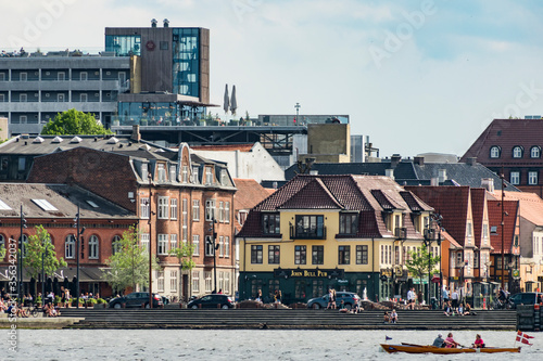 Konstfotografi Aalborg, Denmark People kayaking in the harbour area outside the downtown