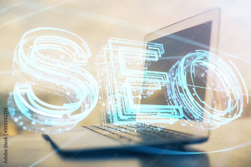 Double exposure of table with computer and seo drawing hologram. Search optimization concept. Double exposure of table with computer and seo drawing hologram. Search optimization concept.