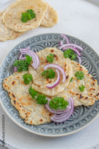 Onion naan - traditional indian bread. pita bread or scones with green onions
