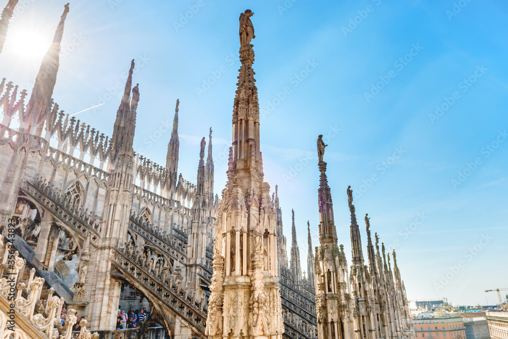 View from roof of Duomo gothic cathedral to piazza square in Milan