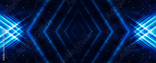 Abstract blue dark background with lines and rays. Symmetric reflection of neon light. Light tunnel, sparks. The movement of light. Night view.