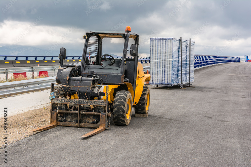 Exterior small forklift at road construction works