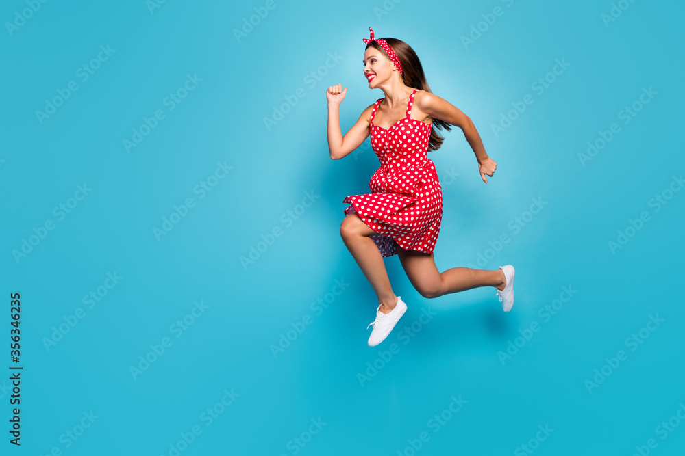 Full length body size view of her she nice-looking attractive lovely purposeful cheerful cheery straight-haired girl jumping running fast isolated on bright vivid shine vibrant blue color background