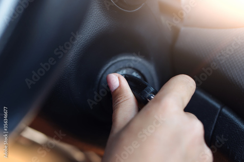 Fotografie Woman starting a new car.