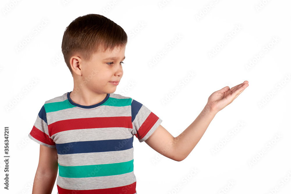 Little kid pointing on something, isolated on white background. Copy space. Little kid pointing on something, isolated on white background. Copy space.