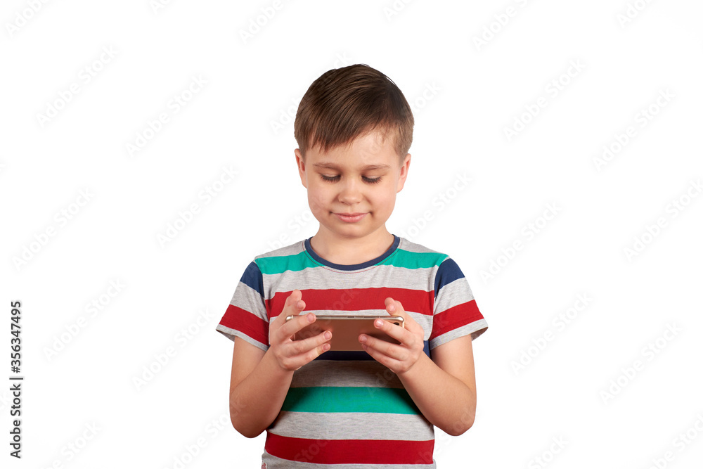 Little kid playing games on smartphone isolated over white background Little kid playing games on smartphone isolated over white background