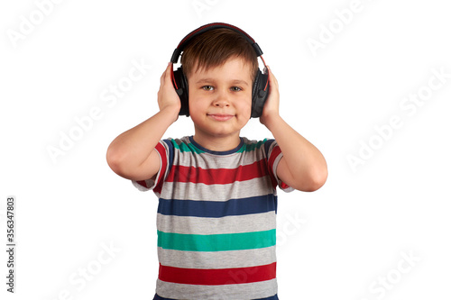Adorable cute child enjoying favorite songs using wireless headphones. isolated on white background. Leisure, music and entertainment concept.