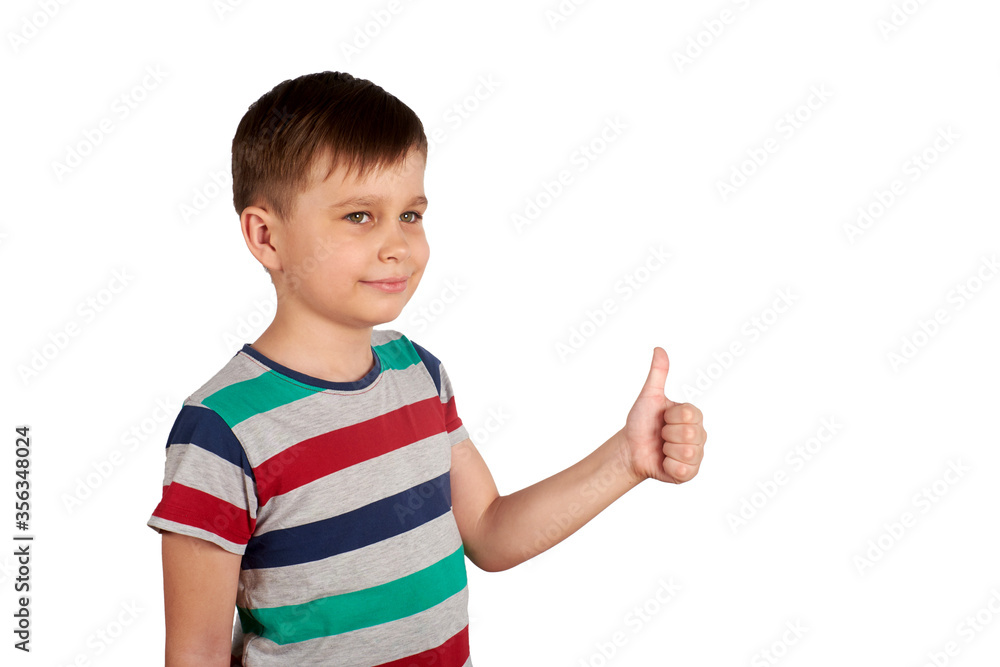 Portrait of attractive young boy, smiling showing thumbs up, on white background. Copy space Portrait of attractive young boy, smiling showing thumbs up, on white background. Copy space