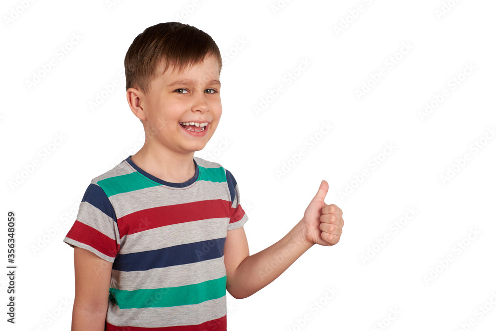 Portrait of attractive young boy, smiling showing thumbs up, on white background. Copy space Portrait of attractive young boy, smiling showing thumbs up, on white background. Copy space