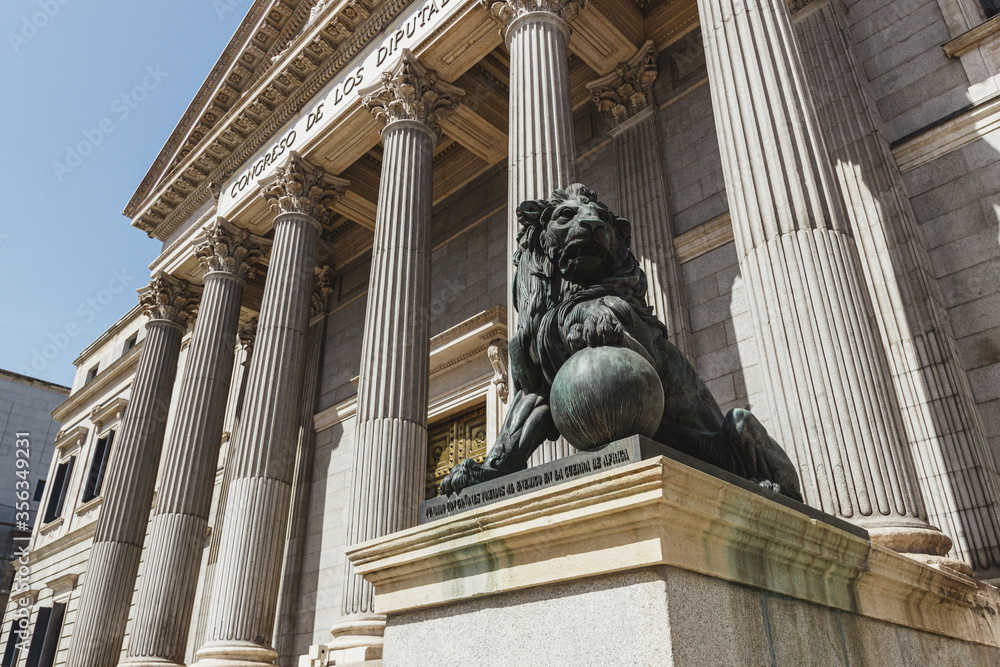 Facade of the Congress of Deputies in Madrid Spain. With lion in the foreground.