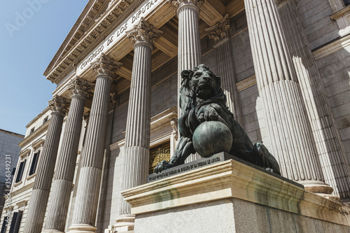 Facade of the Congress of Deputies in Madrid Spain. With lion in the foreground.