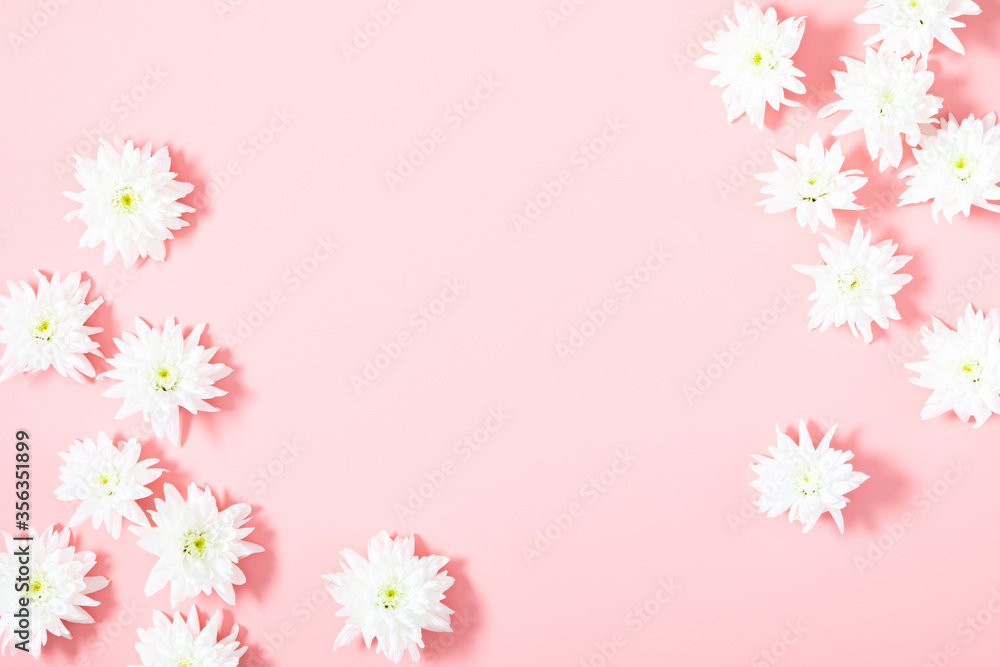 Beautiful flowers composition. White flowers on pastel pink background. Flat lay, top view, copy space